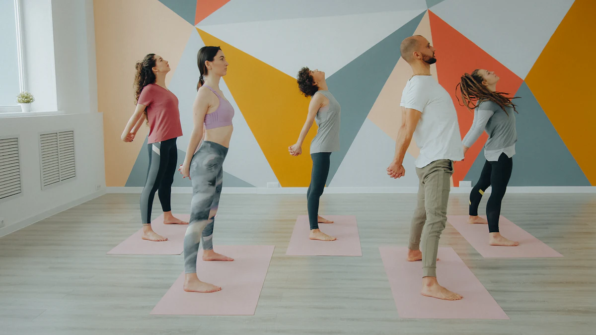 A small class stretching together in a colourful studio